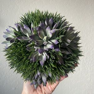 Succulent foliage ball with faux purple succulent and faux grass approx 10”